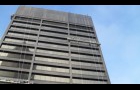 equitable building during retrofit of anodized aluminum curtain wall panels